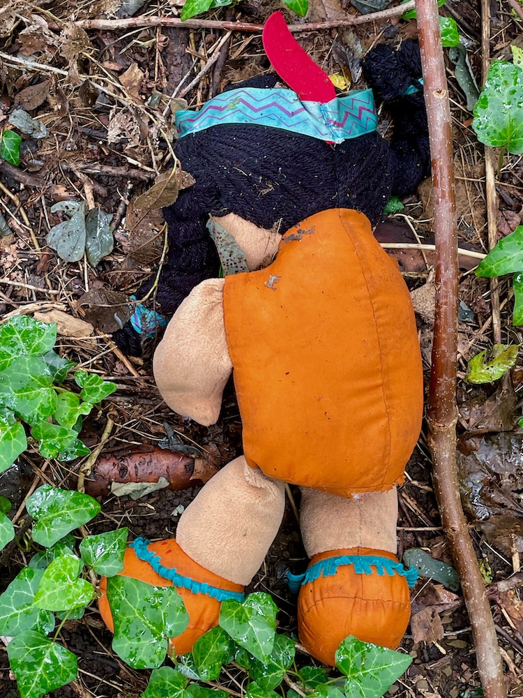 baby doll face down in the woods