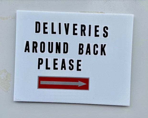 instructions for package delivery taped to front door
