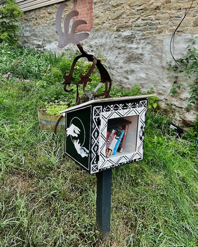 little free library painted black and white