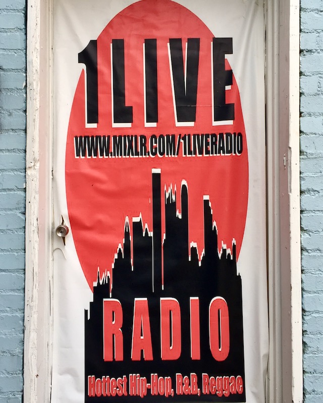 door sign featuring digitized image of downtown Pittsburgh skyline