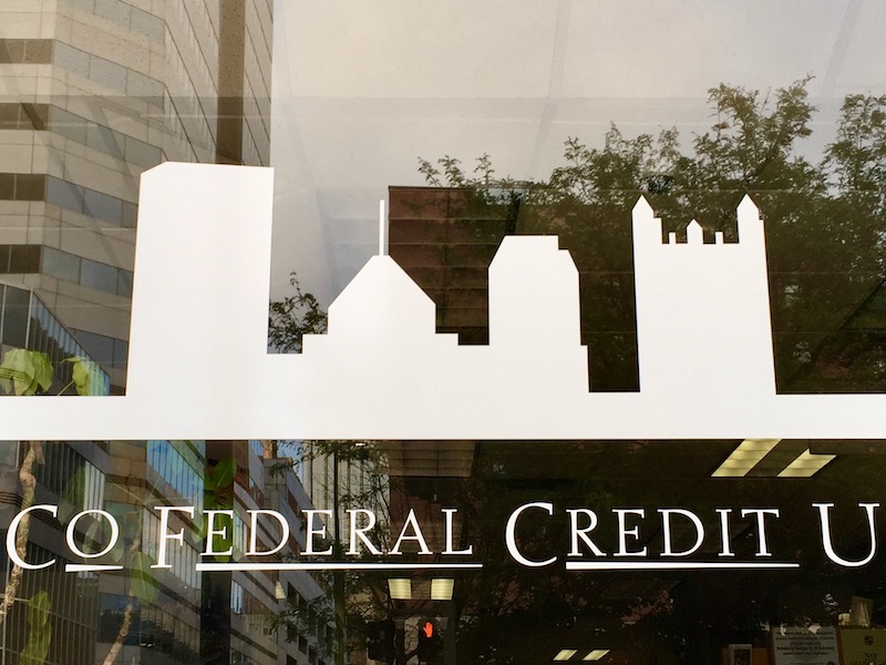 City Co. Federal Credit Union window decal featuring silhouette of downtown Pittsburgh skyline