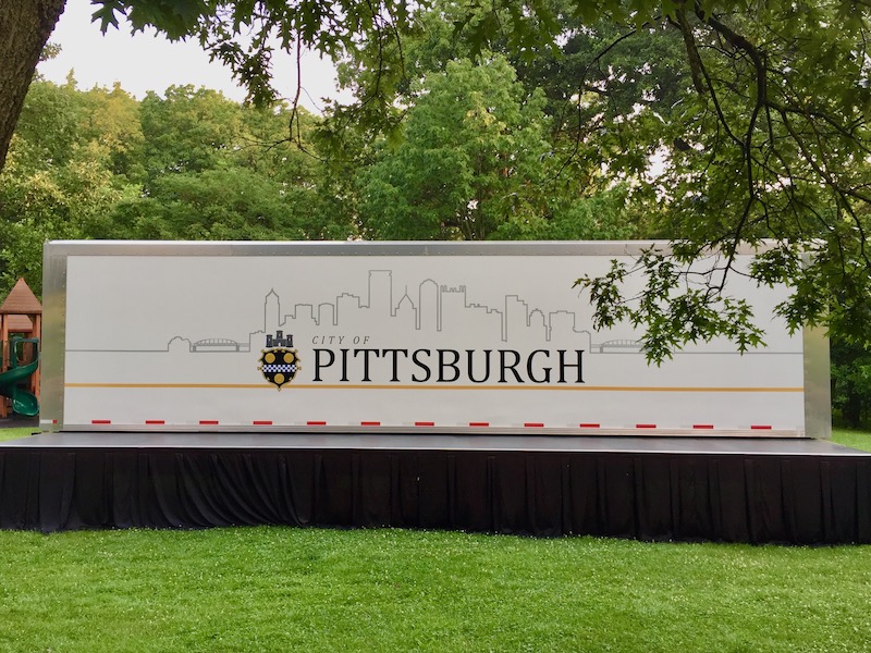 mobile performance stage with silhouette of downtown Pittsburgh skyline
