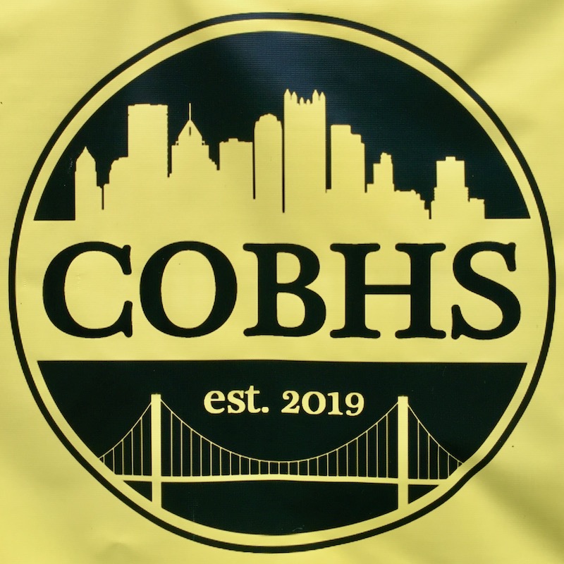 logo for City of Bridges High School featuring silhouette of downtown Pittsburgh skyline