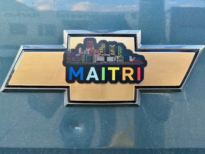 logo for medical marijuana dispensary including downtown Pittsburgh in rainbow