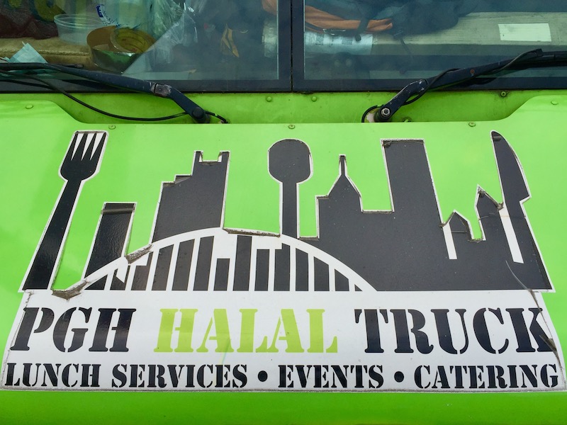 decal on food truck including downtown Pittsburgh skyline with fork, knife, and spoon