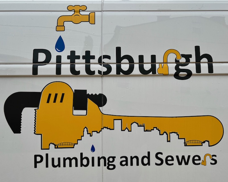 logo for Pittsburgh Plumbing and Sewers including skyline of downtown Pittsburgh in a crescent wrench