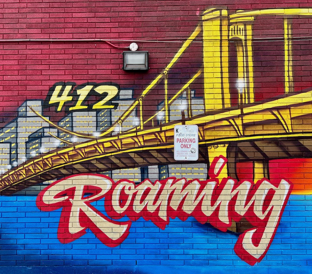mural of yellow bridge and downtown buildings