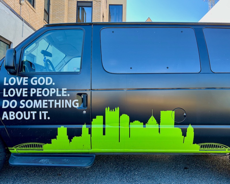 van for Vintage Church featuring silhouette of downtown Pittsburgh