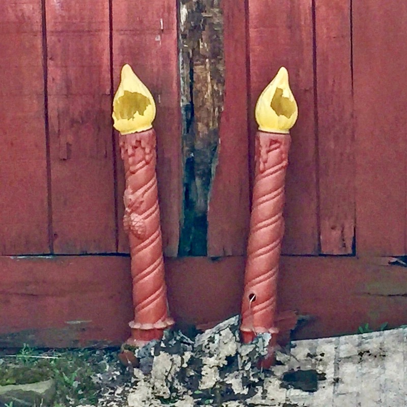 pair of broken plastic decorative Christmas candles