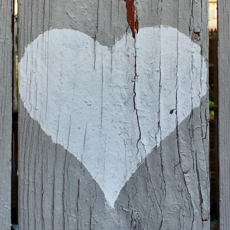 heart painted on wooden fence slat