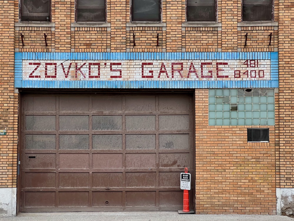 brick auto repair garage with name in painted brick