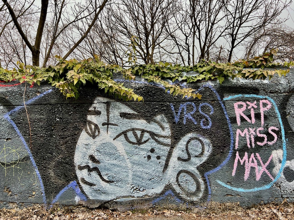 memorial mural on cement walkway wall