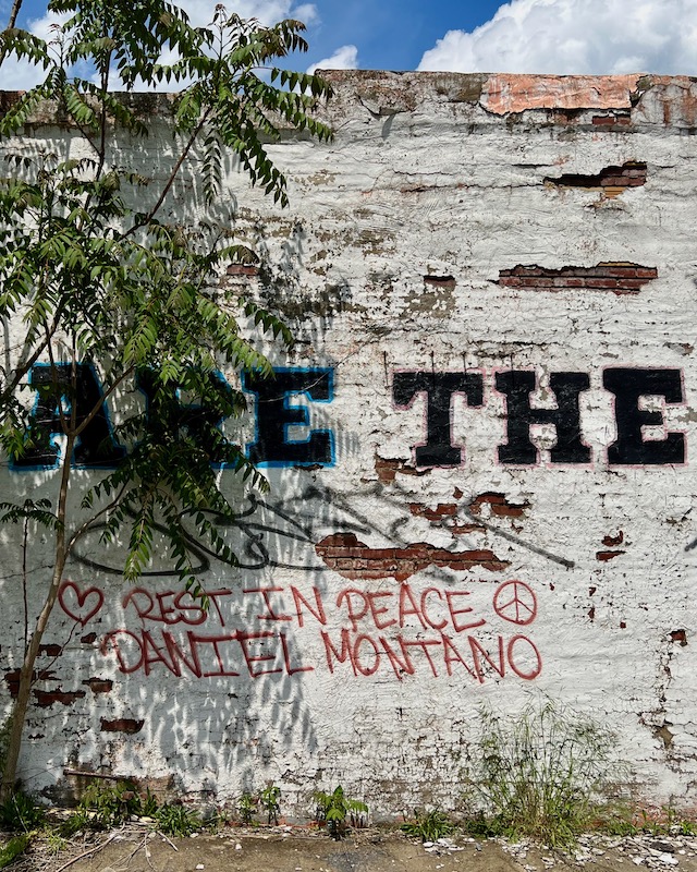 grafitti memorial on brick wall