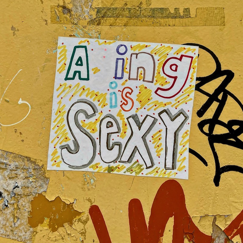 large hand-created sticker with words "Aging is Sexy"