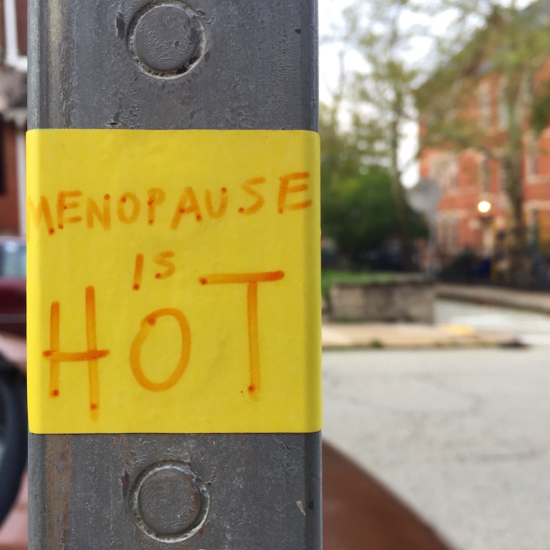 sticker on post reading "Menopause is hot"