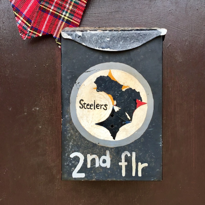 hand-painted mailbox with Pittsburgh Steelers emblem