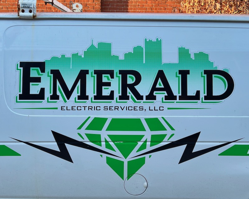electrician's van with image of skyline of downtown Pittsburgh
