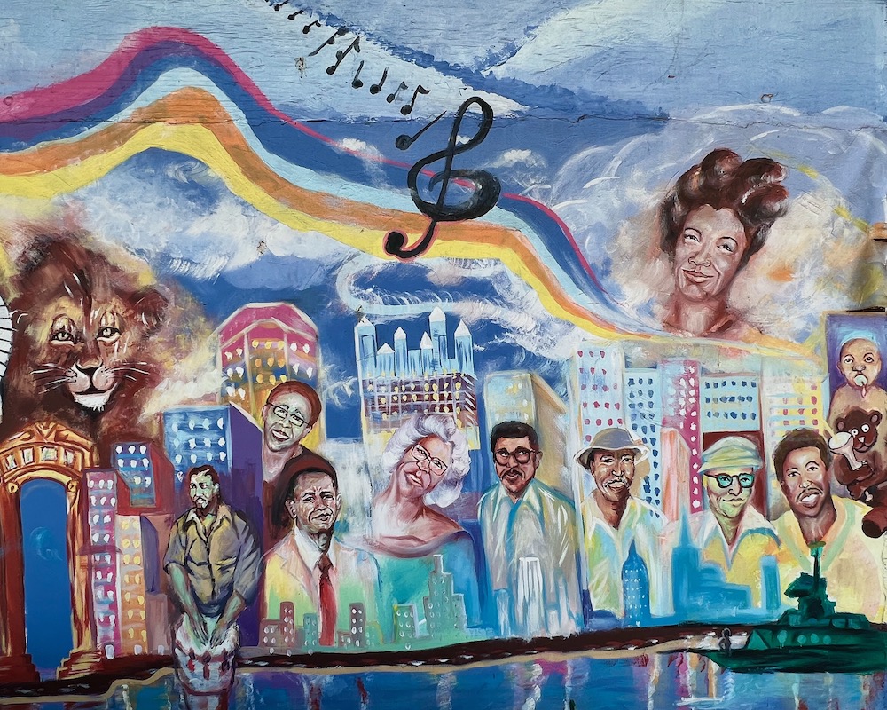 mural including many musicians and skyline of downtown Pittsburgh