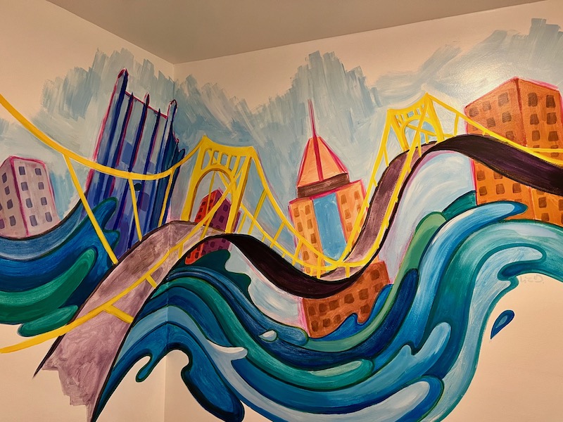mural of downtown Pittsburgh awash with river water