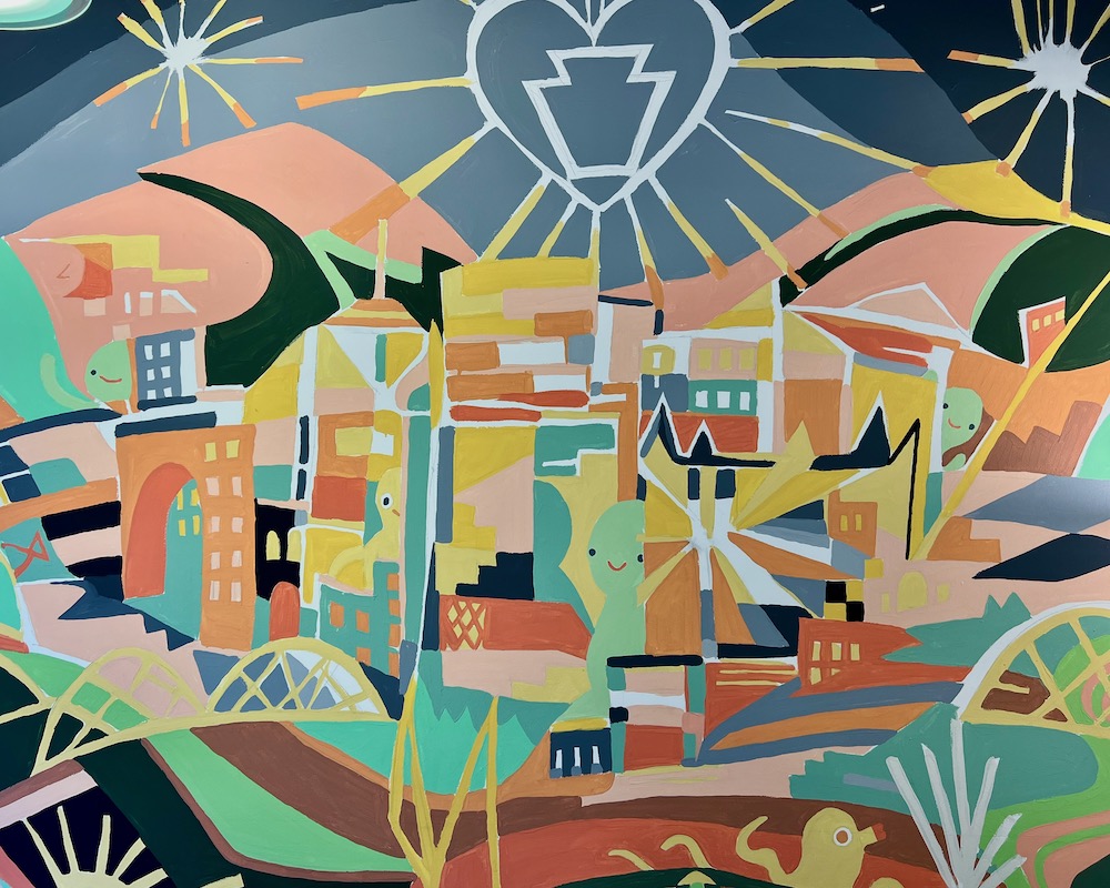 colorful mural of downtown Pittsburgh rendered in cubist style