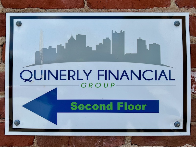 business sign with silhouette of downtown Pittsburgh skyline