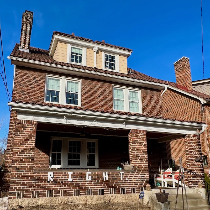 handmade letters attached to residential house reading "right"