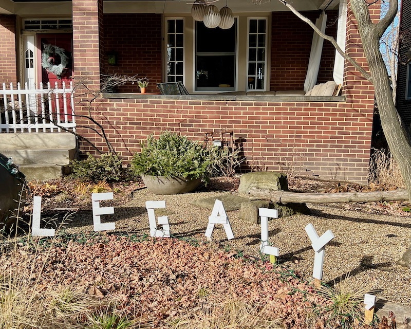 handmade letters attached to residential house reading "legacy"