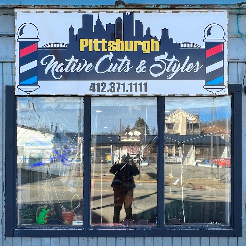 barber shop sign including skyline of downtown Pittsburgh