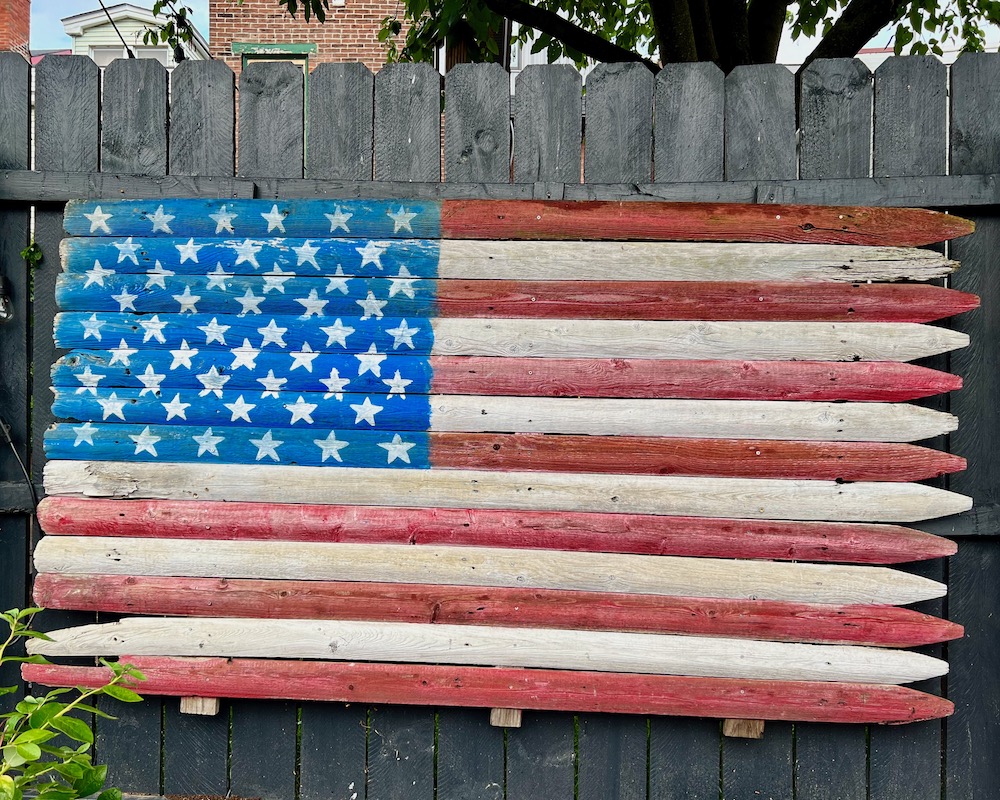 American flag made from section of fence