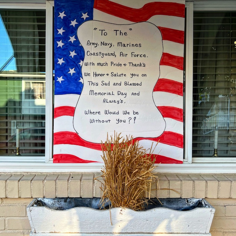Handmade tribute to American armed services in row house window