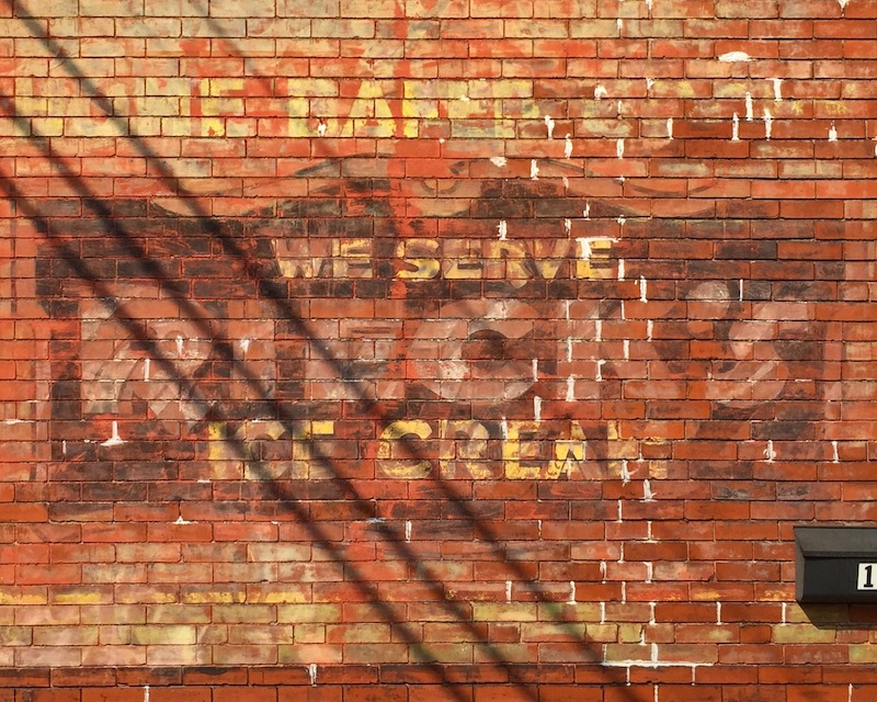 faded "ghost sign" for ice cream parlor