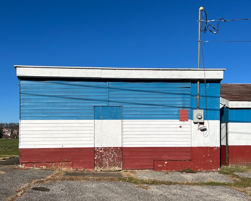 small building painted red, white, and blue