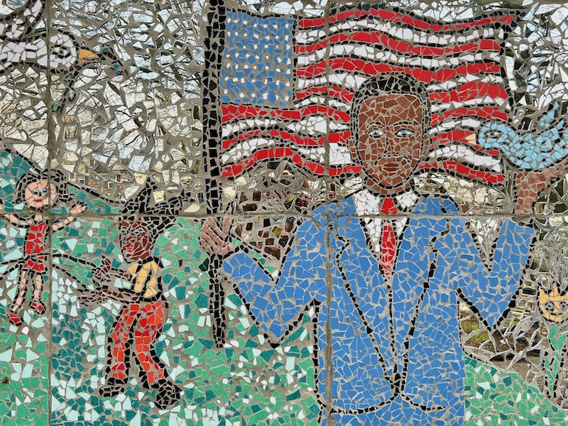 mosaic of man holding American flag