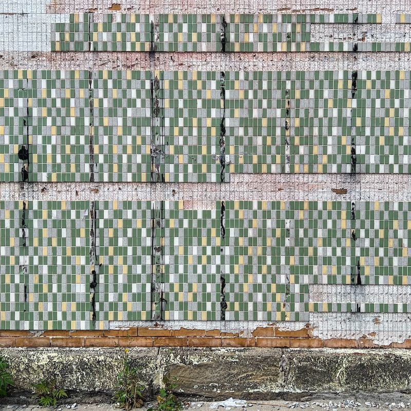 wall partially-covered in tile