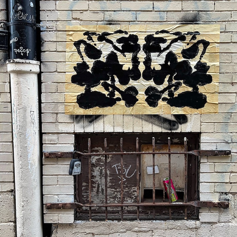 brick wall with wheat paste Rorschach print