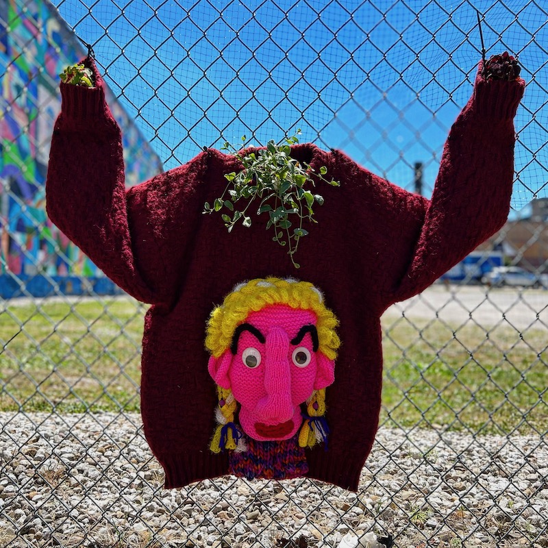 sweater with large crocheted face attached