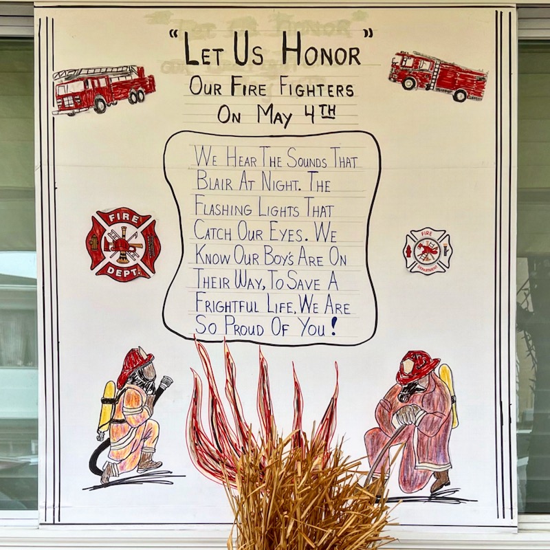 handmade tribute poster to fire fighters with odd quotation marks