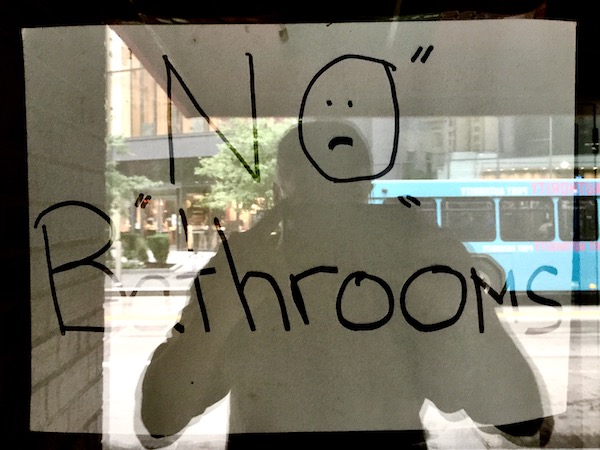 Sign in shop window using quotation marks for emphasis