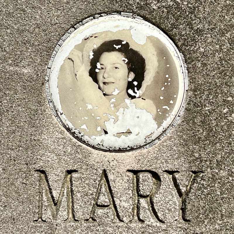 ceramic photograph inset in gravestone