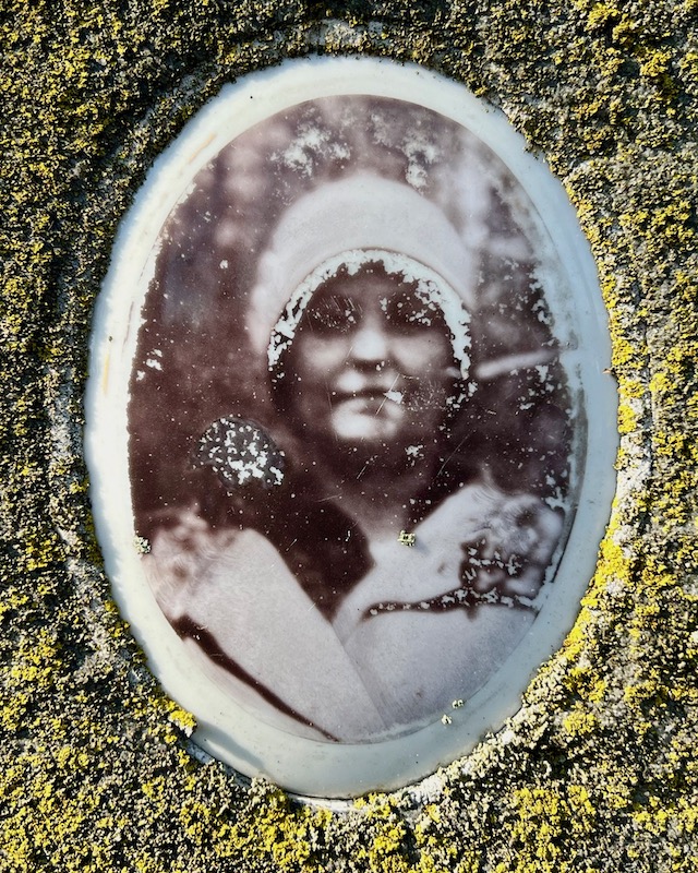 ceramic photograph inset in gravestone