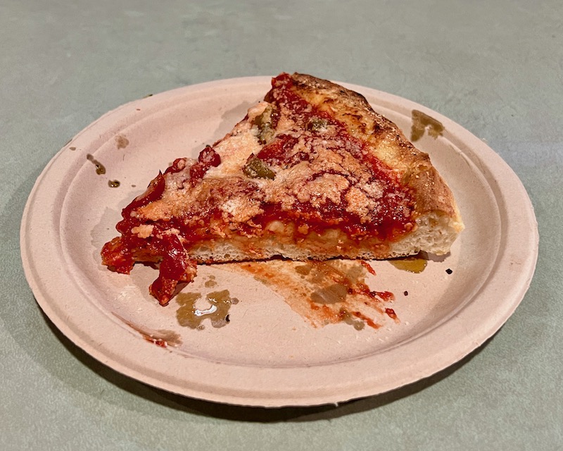 slice of Brier Hill pizza on a paper plate