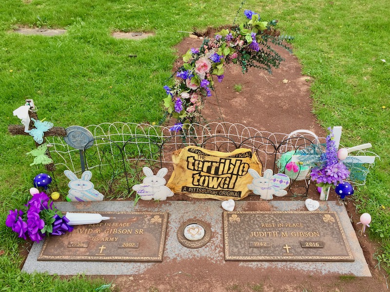 grave marker decorated with Pittsburgh Steelers "terrible towel"