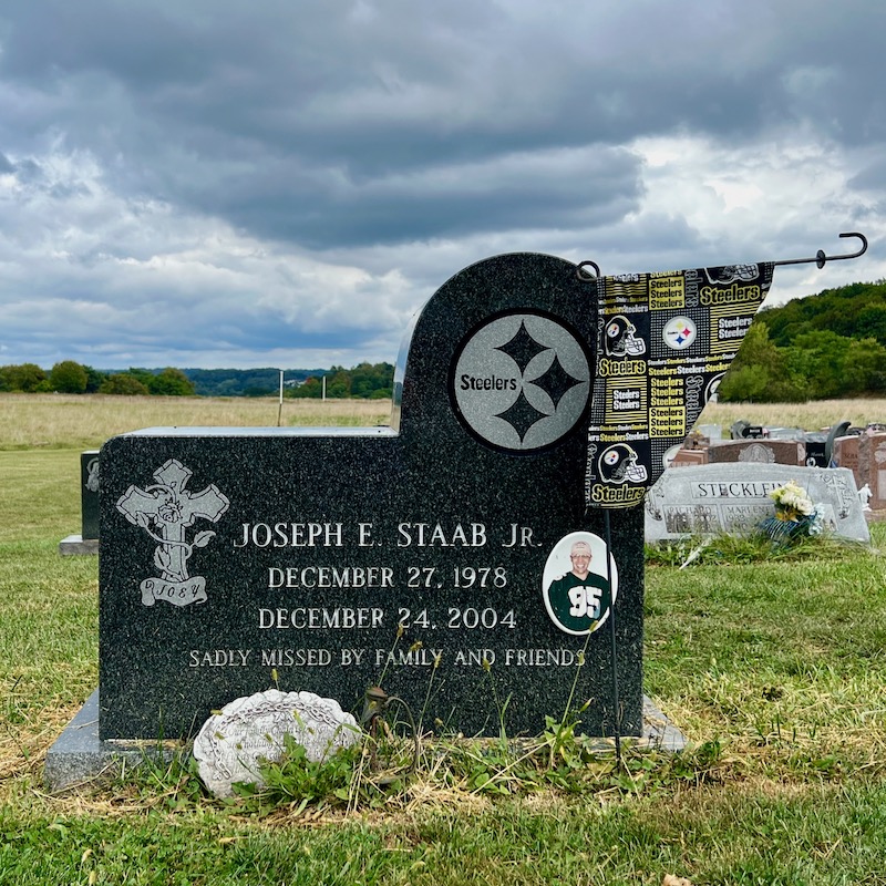 grave marker with emblem of the Pittsburgh Steelers