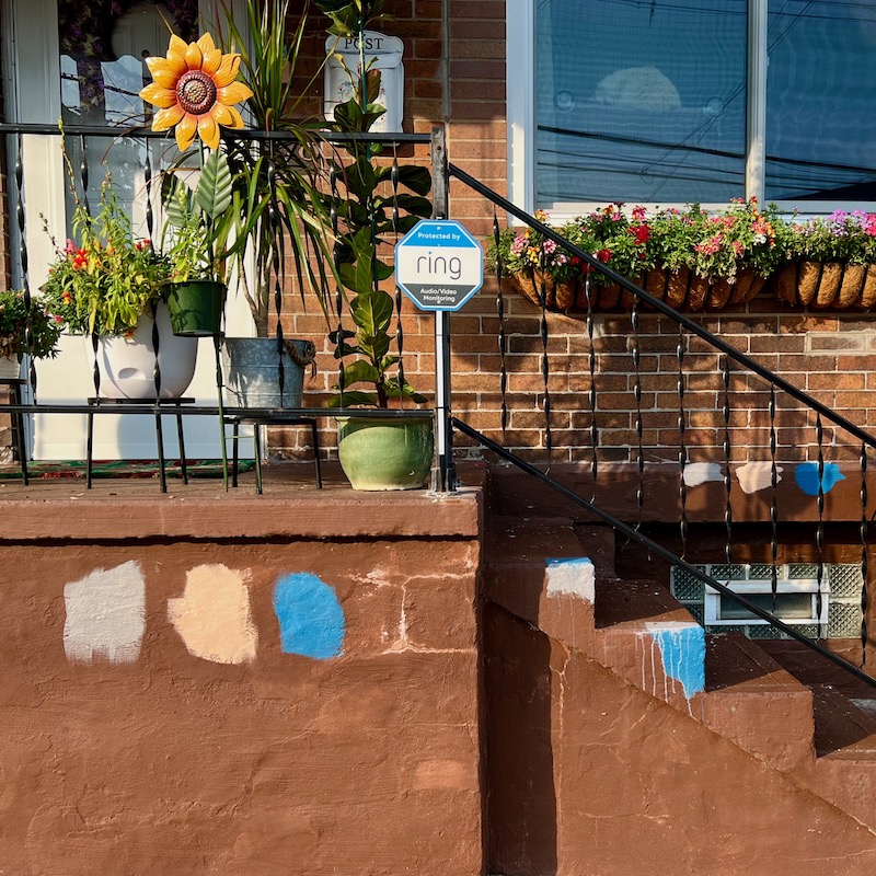 paint swatch test on row house front stoop