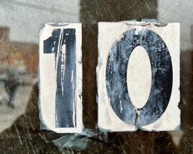 weathered number 10 on glass door